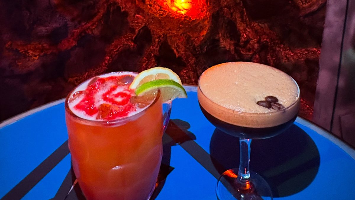Fab Cafe's basement bar, with disco lights on the dancefloor and TV screens over the bar
